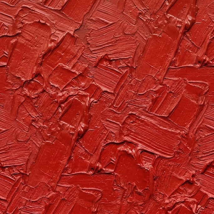 Seamless tileable texture of oil paint impasto red freshly cut and raw