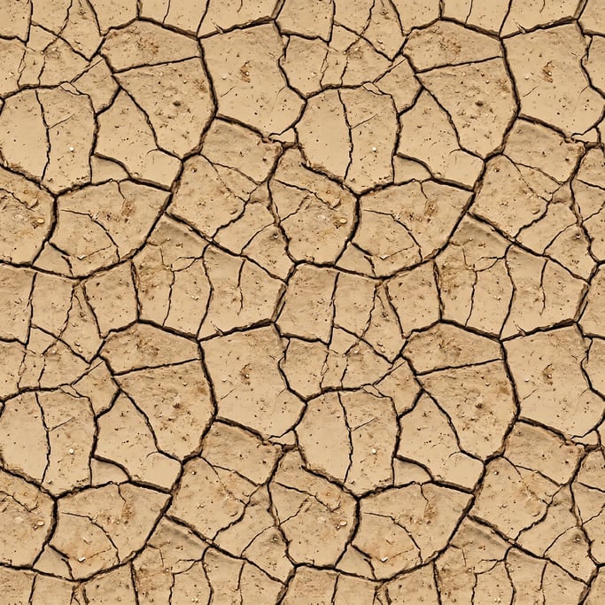 Seamless tileable texture of cracked dry earth in extreme close-up showing micro-detail