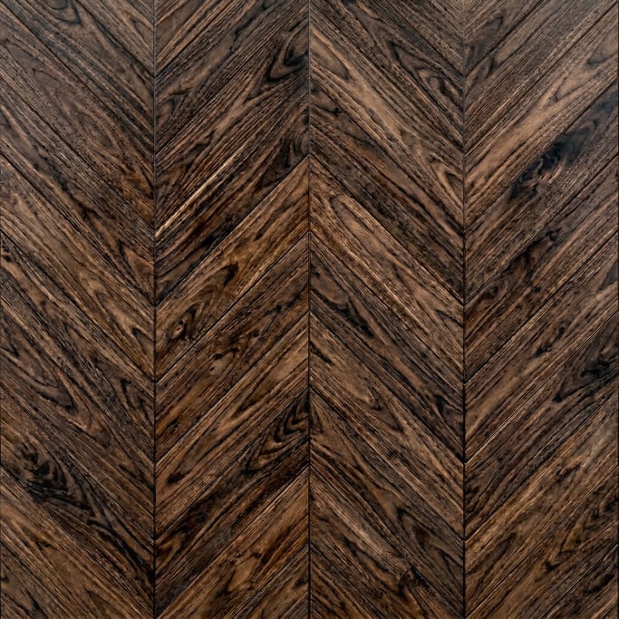 Seamless tileable texture of parquet chevron walnut wet with water