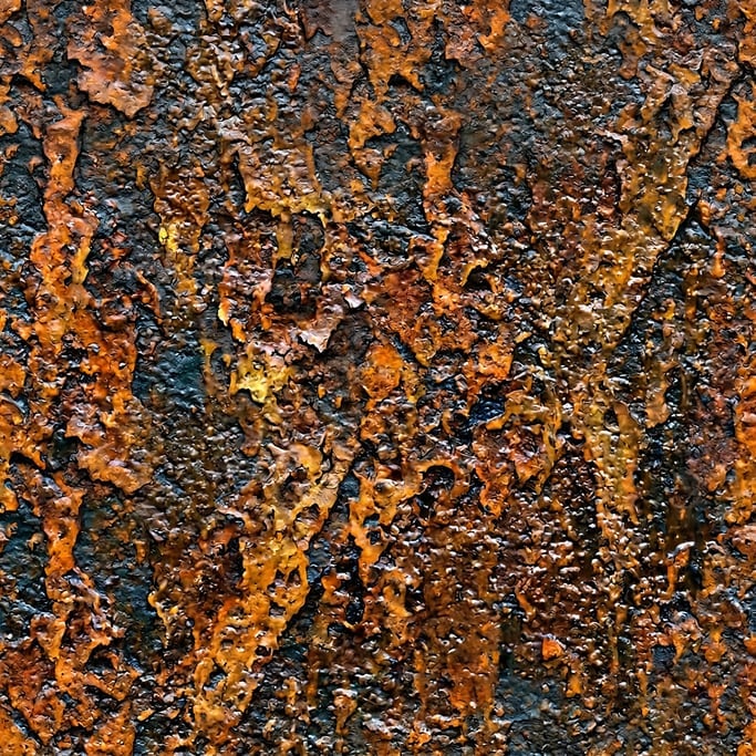Seamless tileable texture of rusted iron wet with water