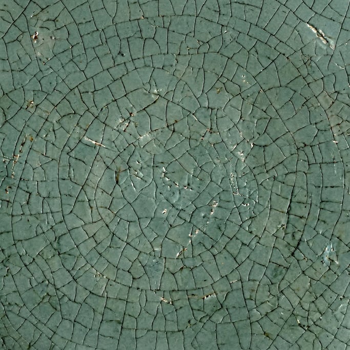 Seamless tileable texture of celadon ceramic lightly weathered and aged