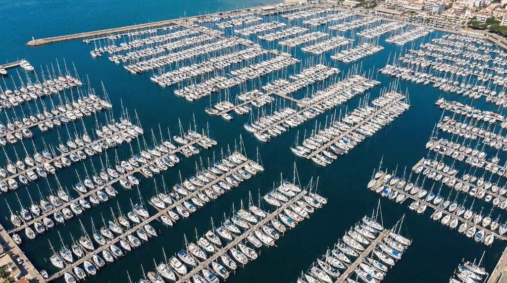 Birds-eye view of a marina packed with sailboats