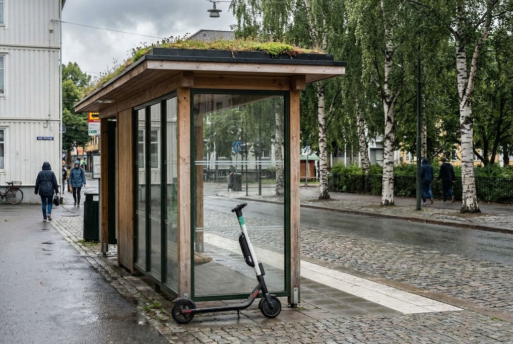 Electric kick scooter leaning against a glass bus shelter on a clean Scandinavian street