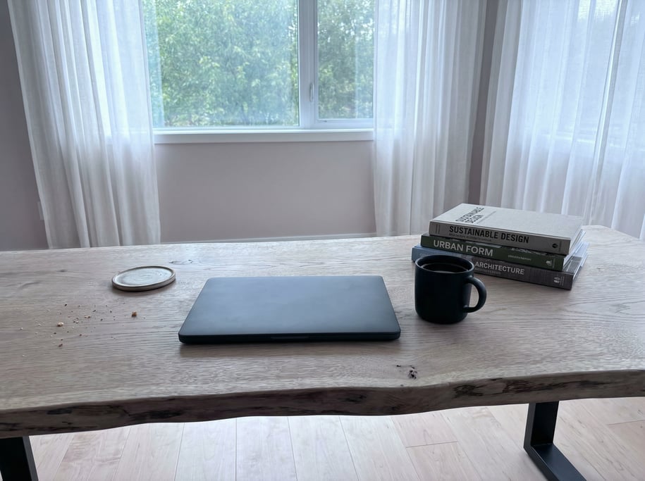 First-person perspective standing at the front edge of the desk