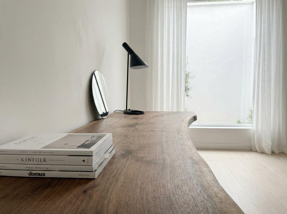 First-person perspective standing at the front edge of the desk