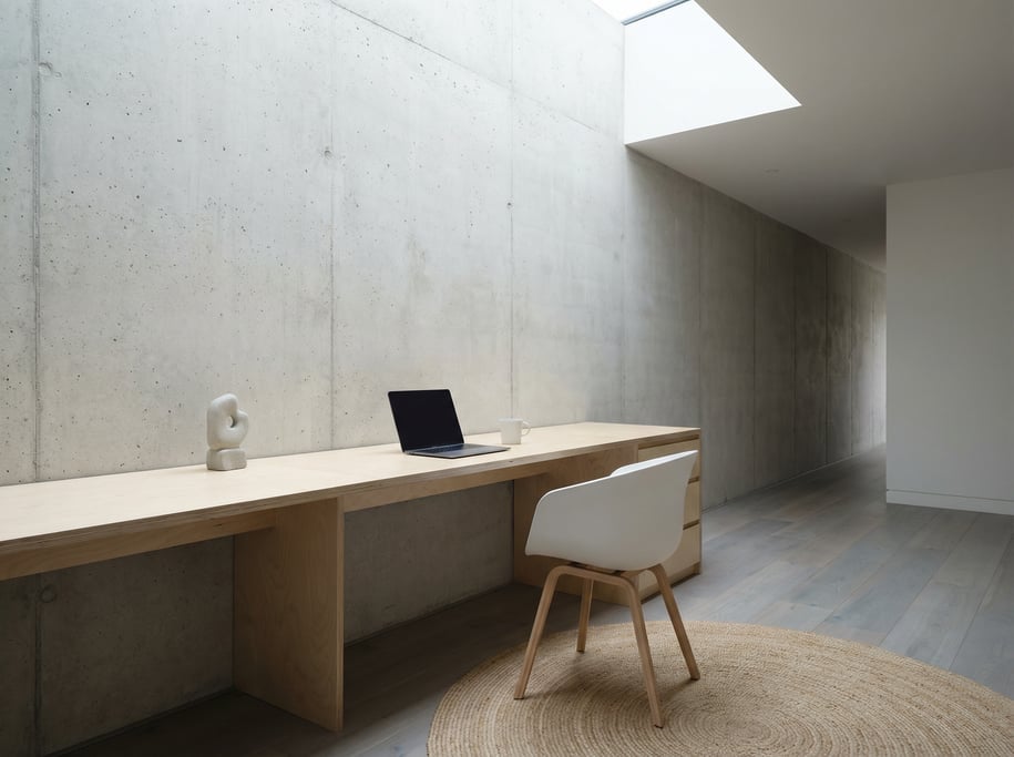 Wide-angle architectural shot of a compact urban home office