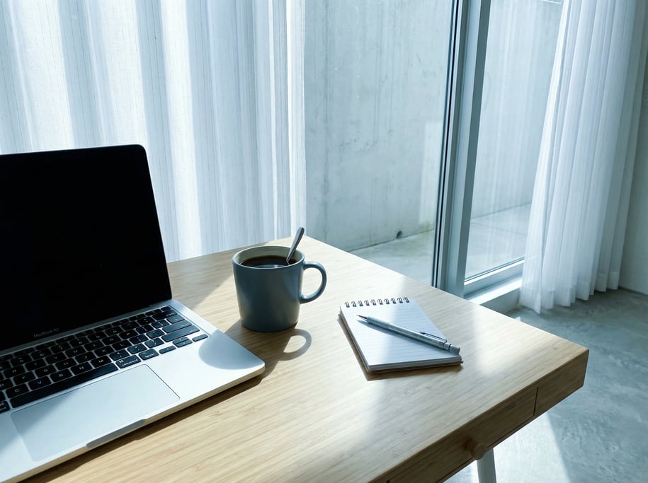 First-person perspective standing at the front edge of the desk